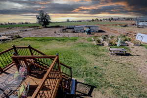 Exterior space with a rural view and a wooden deck