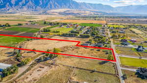 Birds eye view of property featuring a mountain view and a rural view