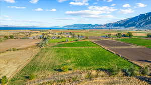 Property view of mountains with a rural view