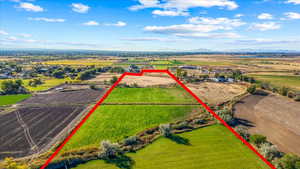 Birds eye view of property with a mountain view and a rural view