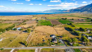 Drone / aerial view with a water and mountain view