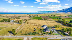 Birds eye view of property with a mountain view and a rural view