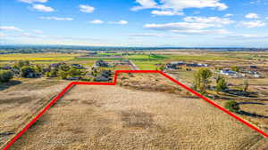 Birds eye view of property featuring a rural view