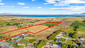 Birds eye view of property featuring a water and mountain view