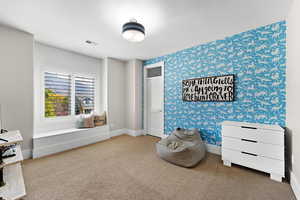 Sitting room featuring carpet