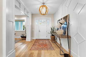 Entrance foyer featuring light wood-type flooring