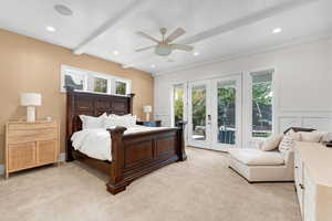 Bedroom featuring french doors, multiple windows, access to outside, and ceiling fan