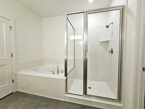 Bathroom featuring plus walk in shower