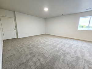 Unfurnished room featuring carpet