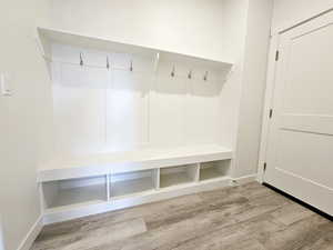 Mudroom with wood-type flooring