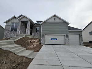 Craftsman-style home with a garage