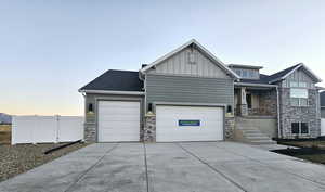 View of front of property featuring a garage