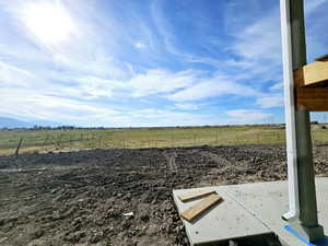 View of yard featuring a patio area and a rural view