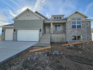 View of front facade featuring a garage