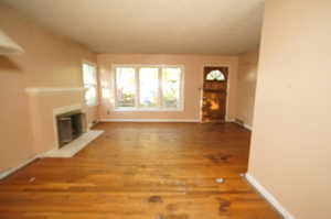 Unfurnished living room with wood-type flooring