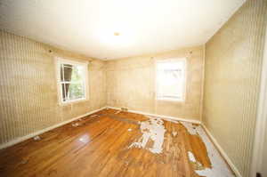 Empty room featuring hardwood / wood-style flooring