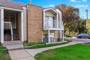 View of home's exterior with a balcony