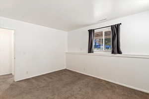 Empty room with dark carpet