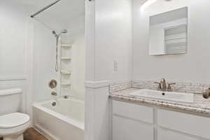 Full bathroom with vanity, toilet, and shower / bathing tub combination