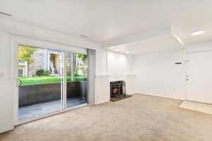 Unfurnished living room with carpet