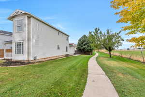 View of home's exterior with a lawn