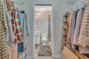 Spacious closet featuring light hardwood / wood-style floors