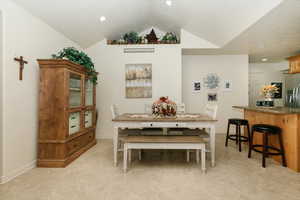 Dining room with vaulted ceiling