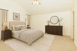 Bedroom with lofted ceiling, ceiling fan, and light carpet