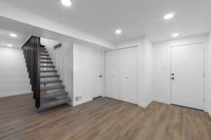 Basement featuring dark hardwood / wood-style flooring