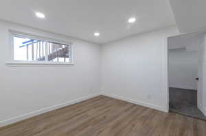 Unfurnished room with hardwood / wood-style floors