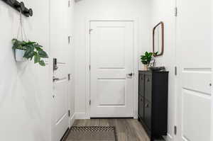 Doorway to outside with hardwood / wood-style floors