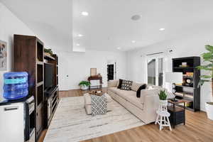 Living room with light wood-style floors