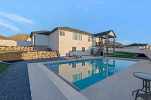 View of pool with a mountain view, a patio