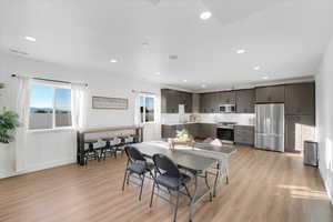 Dining area featuring light wood-style flooring