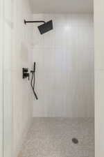 Bathroom featuring a tile shower