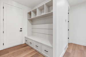 Mudroom with light wood-type flooring