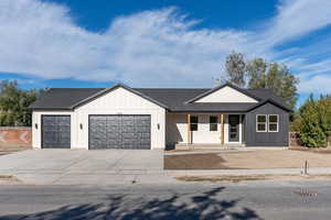 Modern farmhouse featuring a garage