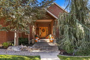 Doorway to property with covered porch