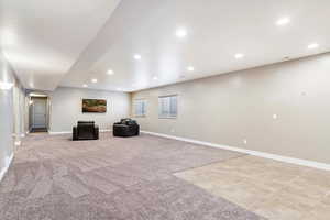 Unfurnished room with light carpet