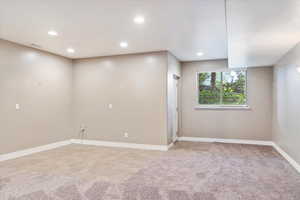 Unfurnished room with light colored carpet