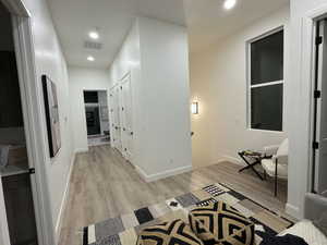 Corridor featuring light hardwood / wood-style flooring