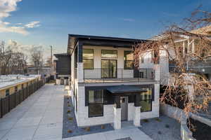 View of front of property featuring a balcony