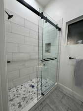 Bathroom featuring walk in shower