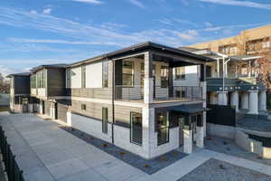 View of home's exterior with a balcony