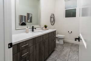 Bathroom with vanity and toilet