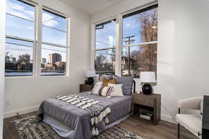 Bedroom with hardwood / wood-style floors