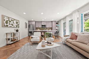 Living room with light parquet floors