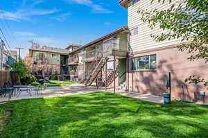 Exterior space featuring a patio area and a yard