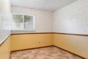 Bonus room featuring a textured ceiling