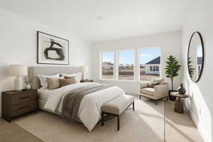 Bedroom with baseboards and light colored carpet
